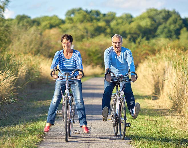 man and woman riding bikes